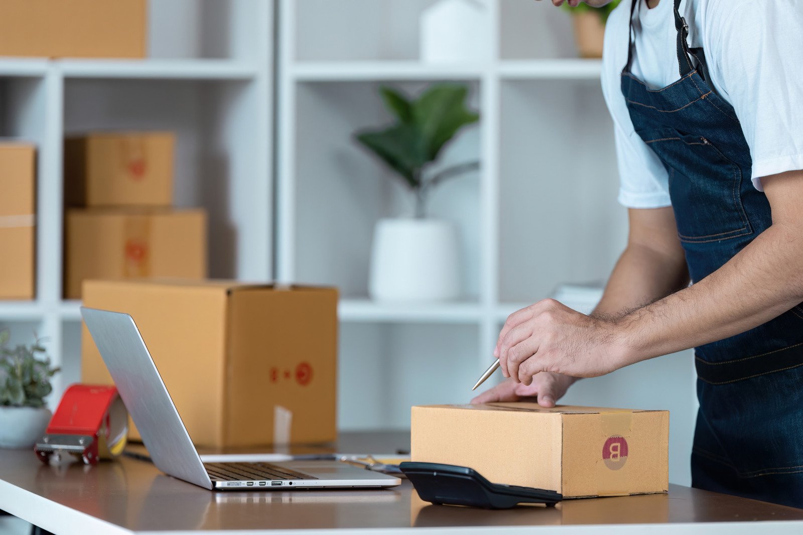This is an image of an ecommerce store owner packing a order for a customer from their woocommerce store in melbourne victoria