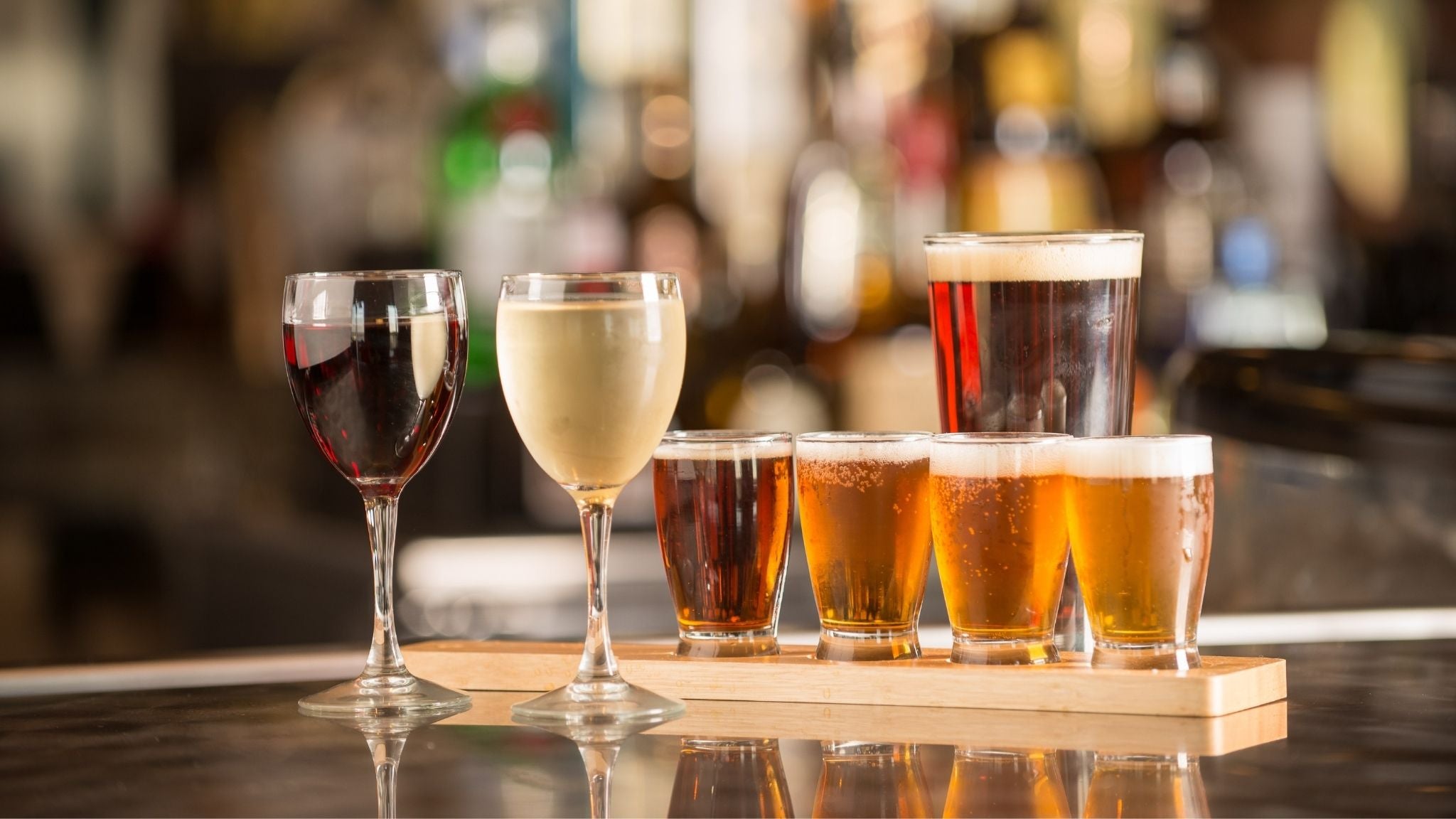 this is an image of a craft beer tasting paddle with multiple beer styles served in glasses at a brewery bar